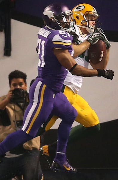 Green Bay Packers wide receiver Jordy Nelson catches an 11-yard touchdown pass against Minnesota Vikings cornerback Josh Robinson last season.