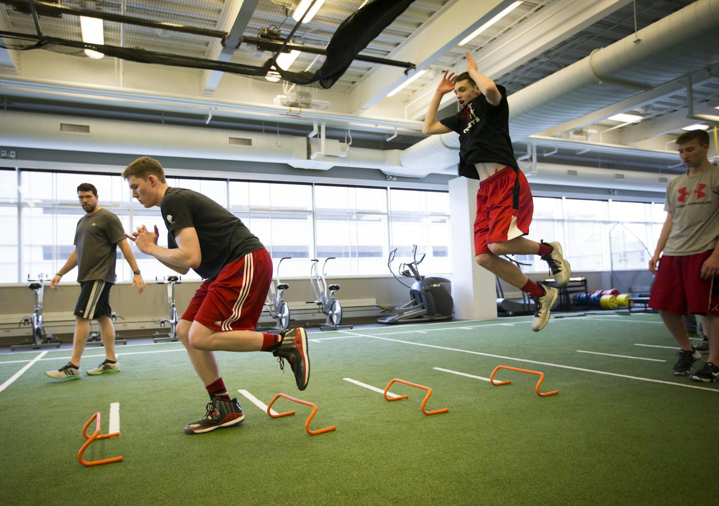 Michael Hurt, left, and his brother Matthew, right, trained with performance coach Casey Clark at the Sports Medicine Center at the Mayo Clinic in Rochester, Minn., on Monday, May 2, 2016. ] RENEE JONES SCHNEIDER * reneejones@startribune.com Michael Hurt was recruited to play basketball for the Gophers' next fall. His freshman brother Matthew is also a basketball player and is already getting college recruitment calls. Add to that their little sister Katie who is also showing promise in the spor