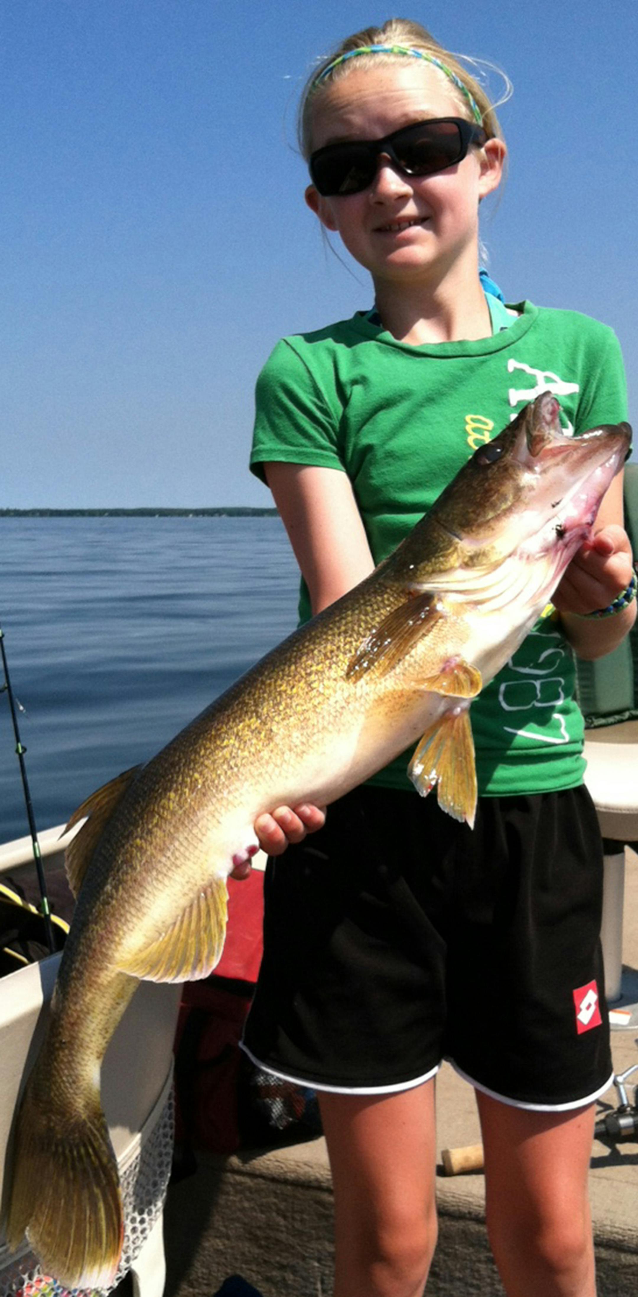 ON HER OWN Jenna Fawcett, 12, of Waconia, caught and released this dandy 29-inch walleye on Lake Mille Lacs while fishing with her dad, Scott. She caught and landed it on her own.