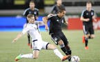 Minnesota United FC's Raul Gonzalez and Vancouver Whitecaps FC's Jordan Harvey battled for the ball Thursday night.