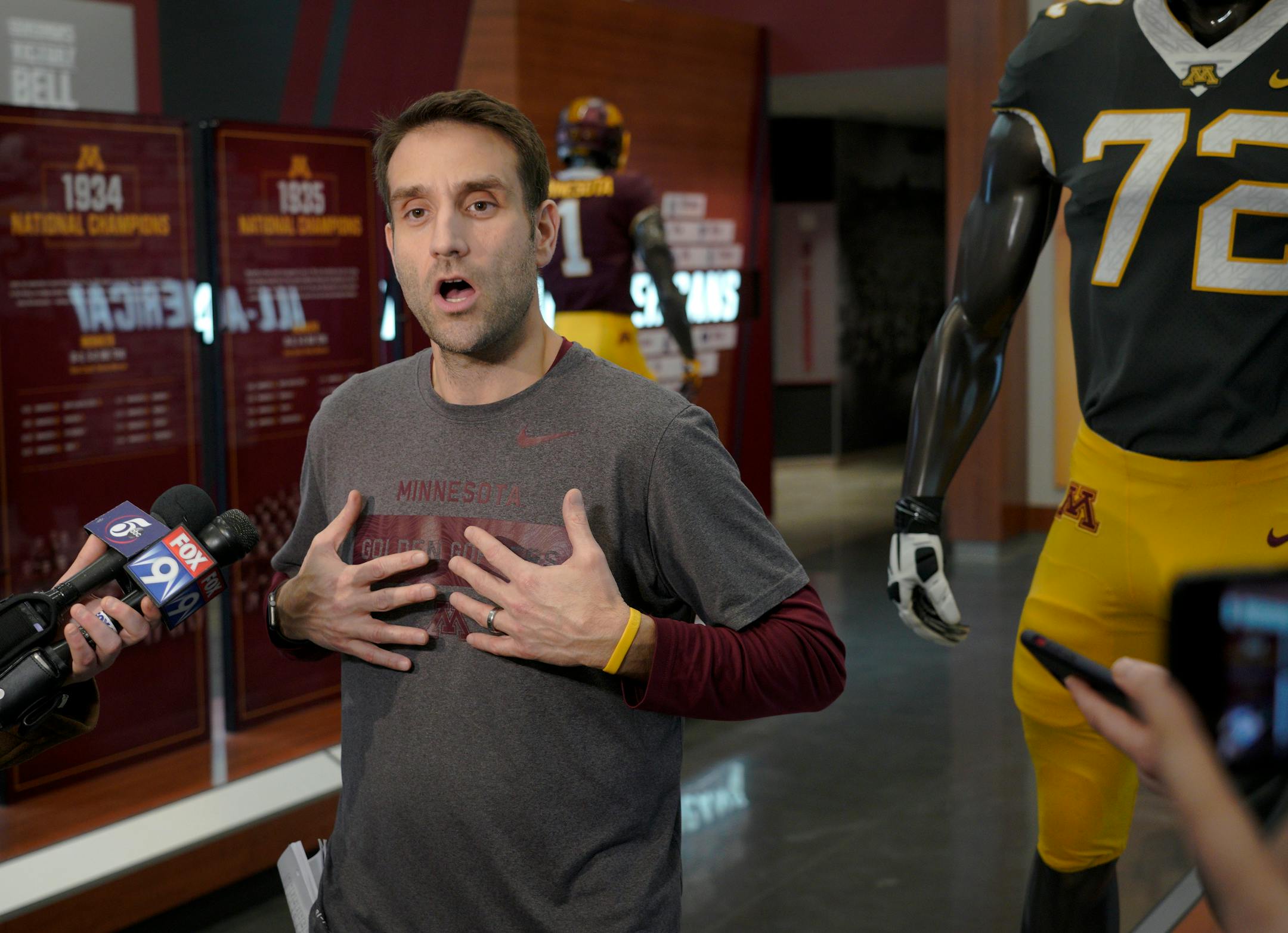 Gophers defensive coordinator Joe Rossi, seen talking with the media after a practice.