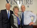 File: Venture Bank President Michael Zenk, Shirley Wikner, president of Aviation Charter and Wikner's loan officer, Venture vice president Kevin Doyle
