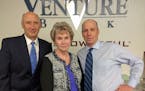 File: Venture Bank President Michael Zenk, Shirley Wikner, president of Aviation Charter and Wikner's loan officer, Venture vice president Kevin Doyle