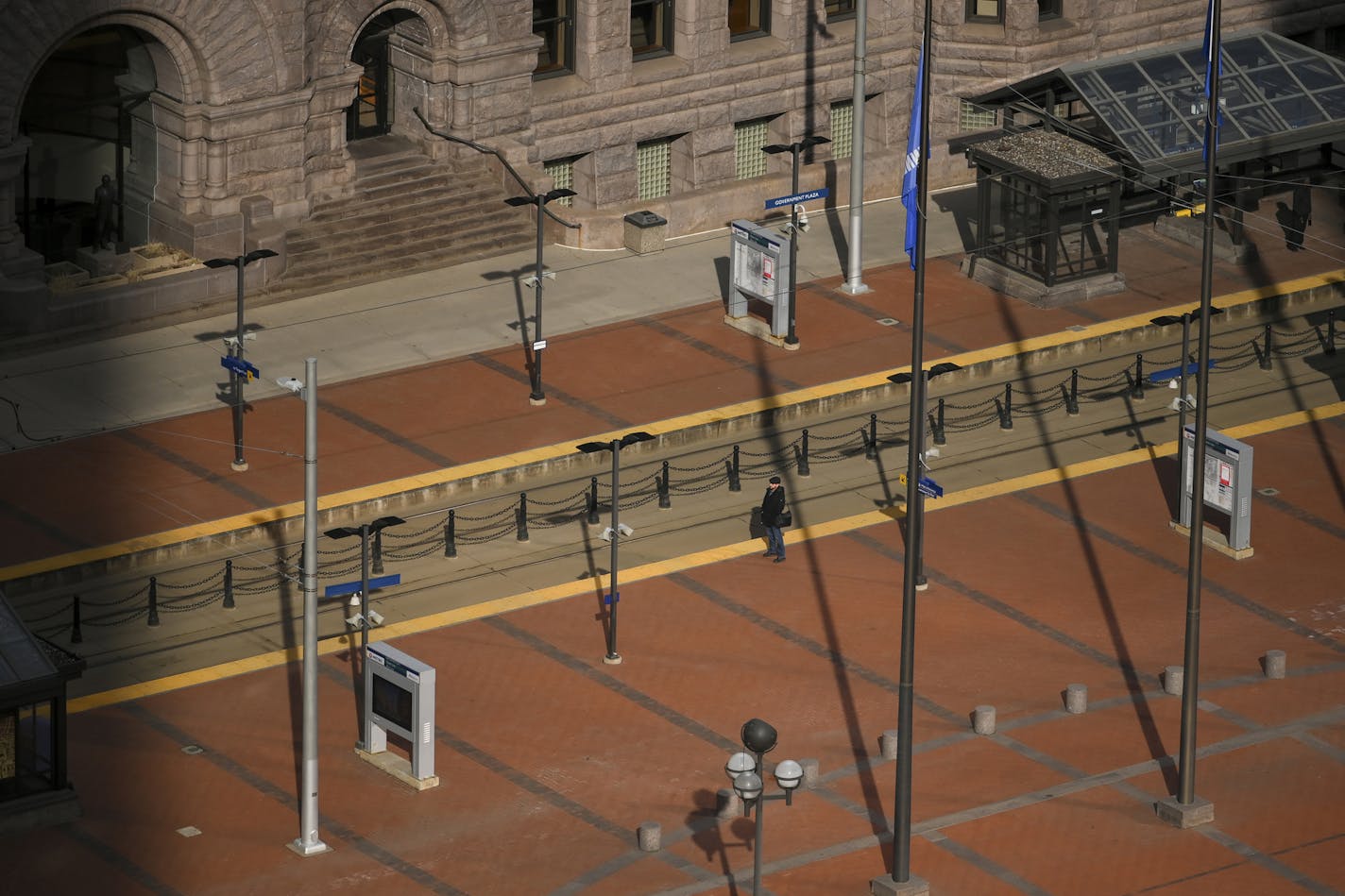 A lone commuter waited for the light rail outside Minneapolis City Hall Thursday. ] Aaron Lavinsky &#x2022; aaron.lavinsky@startribune.com Feature photos taken in Minneapolis, Minn. on Thursday, March 26, 2020.