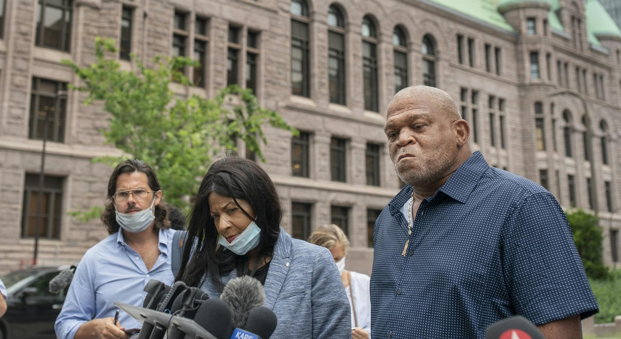 George Floyd's aunt Angela Harrelson of Minneapolis left and his uncle Selwyn Jones of Gettysburg, South Dakota spoke to the members of the media outside of the Hennepin County Public Safety Facility Monday morning .