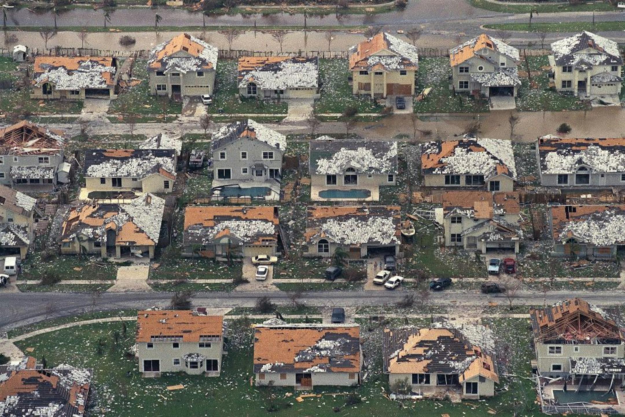 FILE - This Aug. 25, 1992 file photo shows rows of damaged houses between Homestead and Florida City, Fla. Two decades after Andrew devastated the area, Homestead and Florida City have doubled in size into a demographically different community, better prepared to deal with hurricanes.