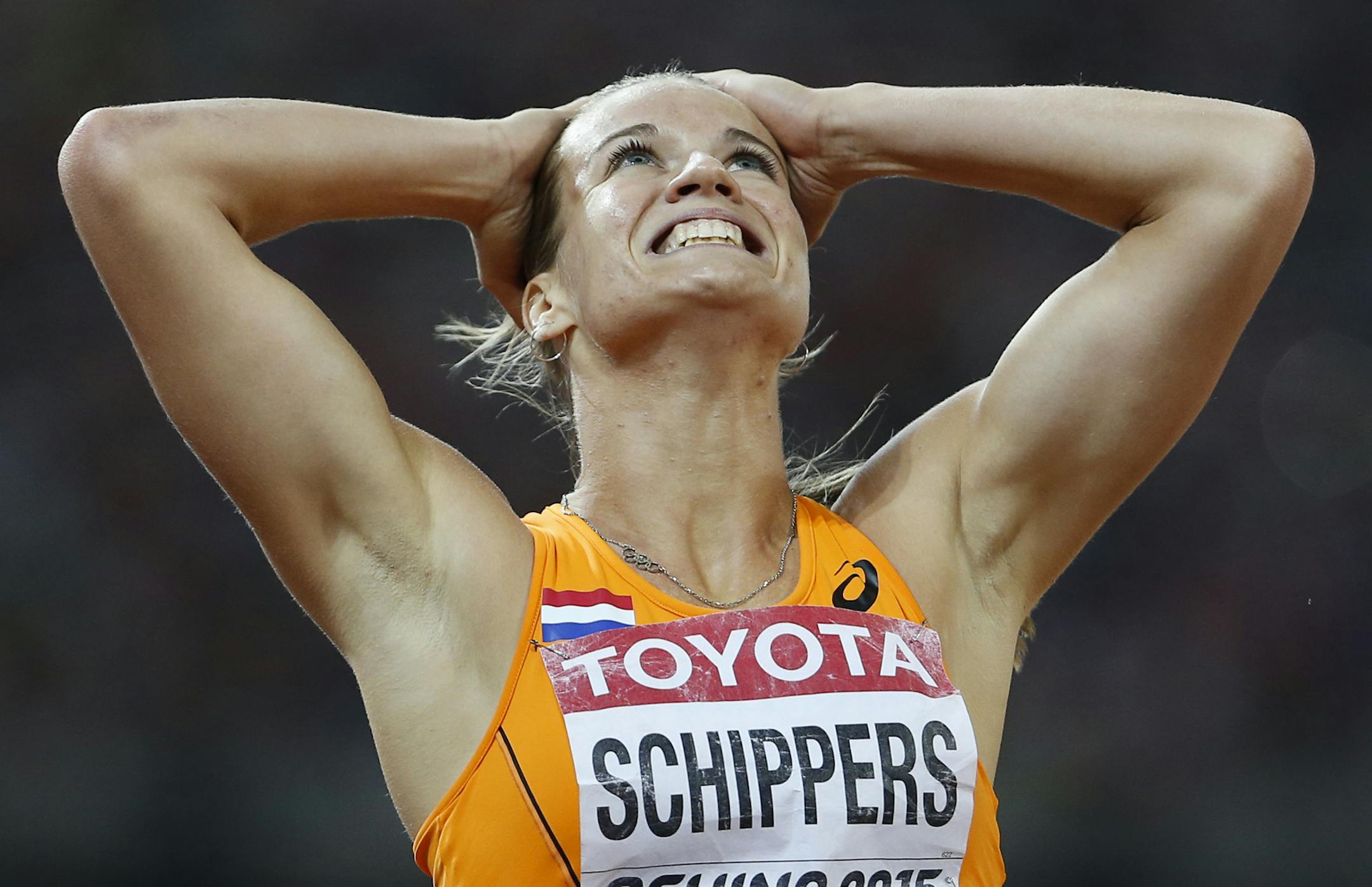 FILE - In this Aug. 28, 2015, file photo, Dafne Schippers, of the Netherlands, celebrates winning the women's 200m final at the World Athletics Championships at the Bird's Nest stadium in Beijing. Schippers wants to break the Jamaica-U.S. dominance in the women's Olympic sprints by improving one place on her performance at the world championships, where she won the 200 and took silver in the 100. (AP Photo/David J. Phillip, File)