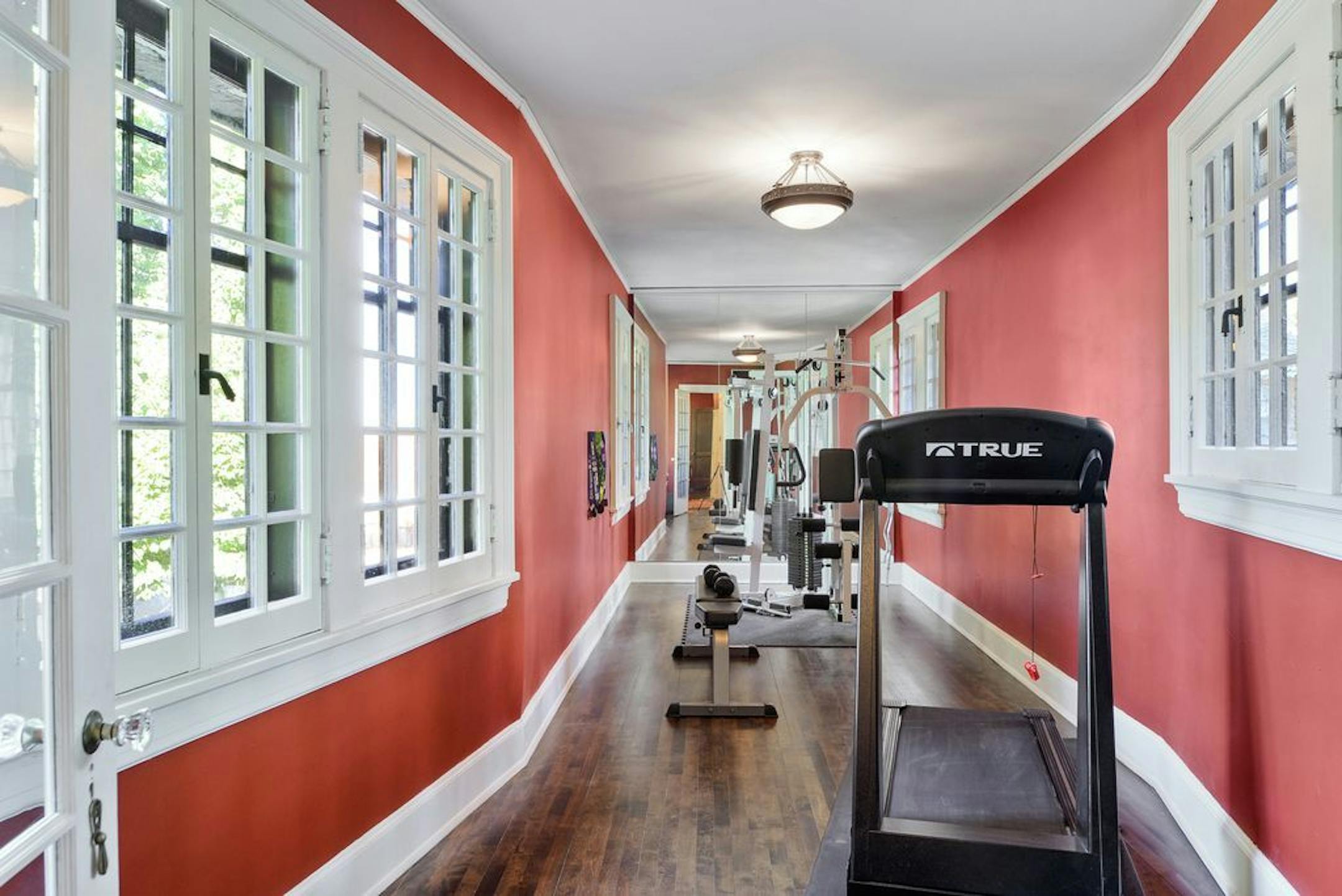 The home includes half of the original skyway, now sealed in the middle. The homeowners use the space as a workout room.