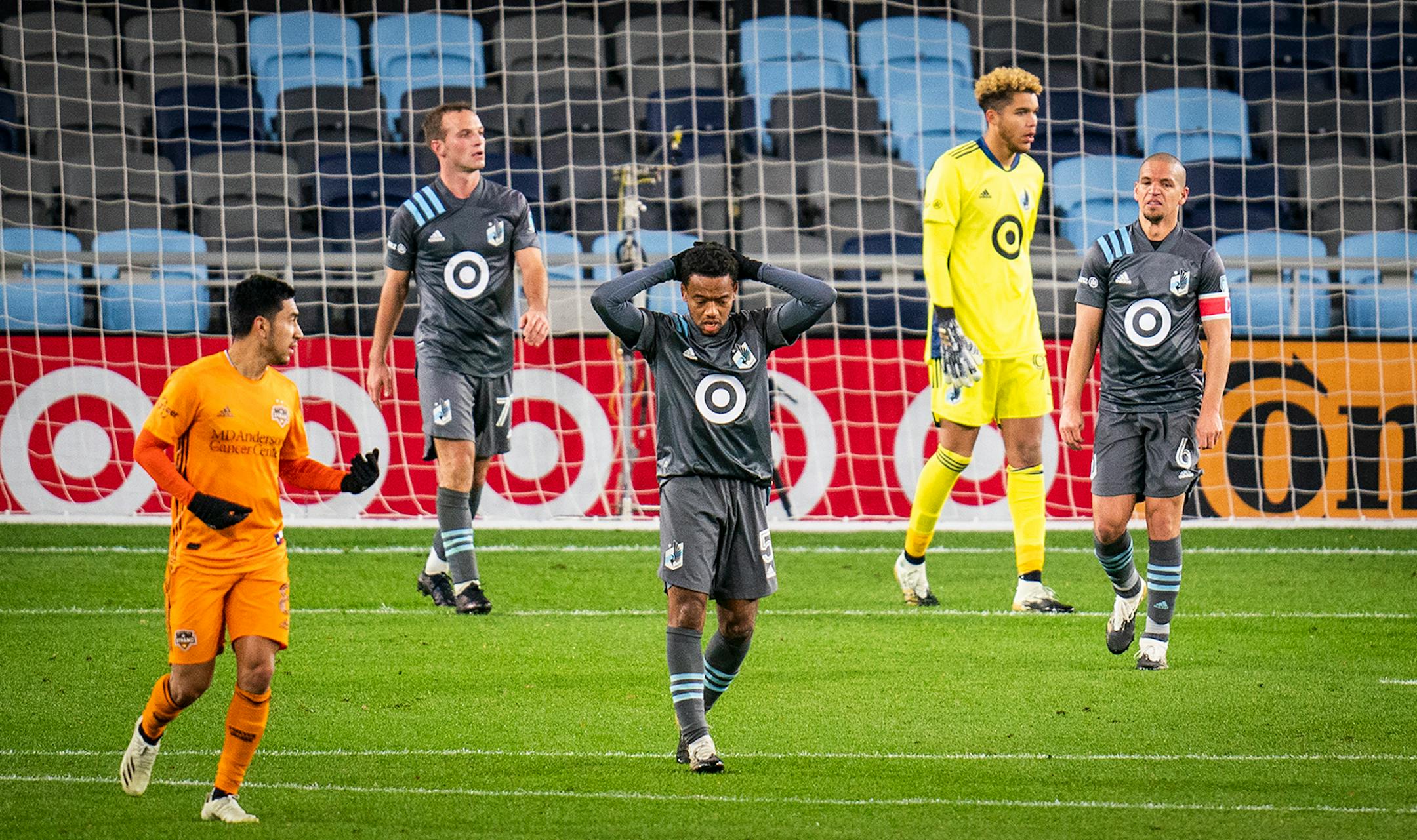 Minnesota United midfielder Jacori Hayes (5), center, reacted to the game being tied 2-2 by a Houston Dynamo goal during the second half.
