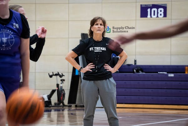St. Thomas women’s basketball coach Ruth Sinn. above at a practice at Schoenecker Arena, signed four players on Wednesday.