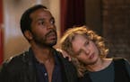 This image released by Netflix shows Andre Holland, left, and Joanna Kulig in a scene from "The Eddy." The musical drama series is a collaboration bet