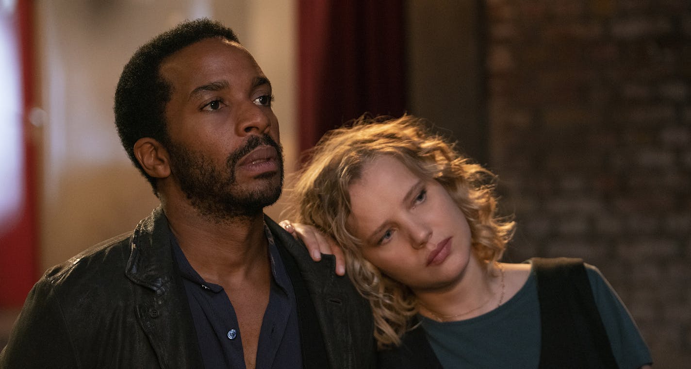 This image released by Netflix shows Andre Holland, left, and Joanna Kulig in a scene from "The Eddy." The musical drama series is a collaboration between "La La Land" director Damien Chazelle and six-time Grammy Award winner Glen Ballard. (Lou Faulon/Netflix via AP)