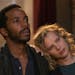This image released by Netflix shows Andre Holland, left, and Joanna Kulig in a scene from "The Eddy." The musical drama series is a collaboration bet