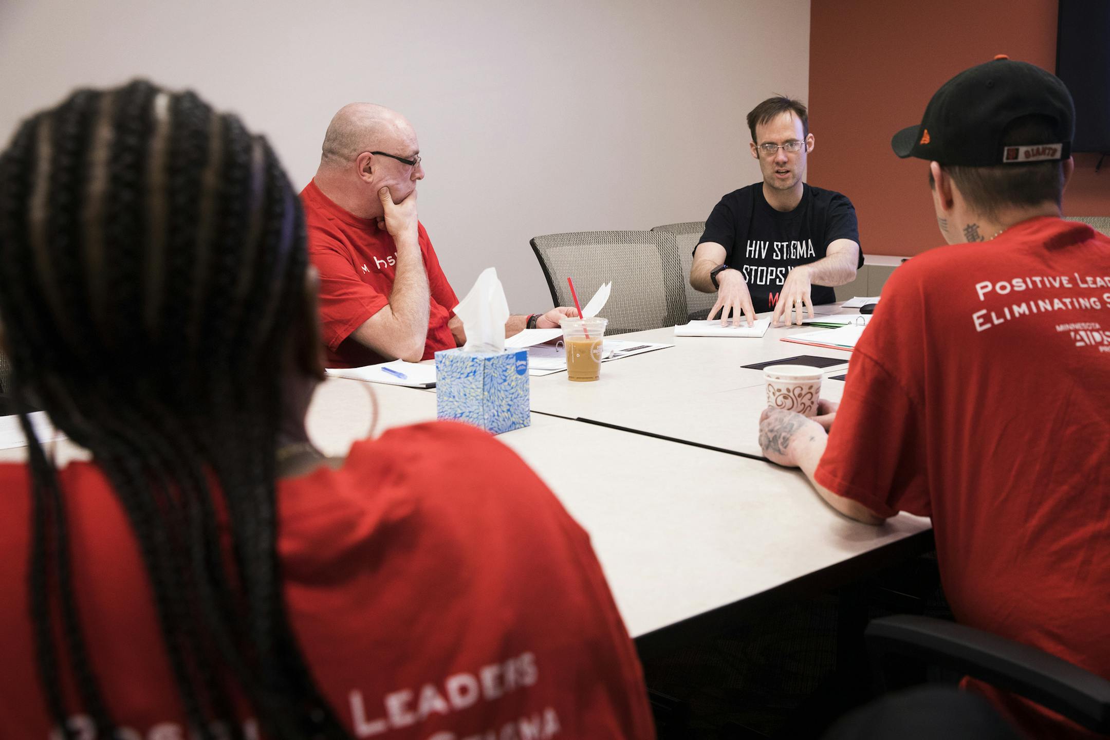 Matt Toburen, top right, the public policy director of the Minnesota AIDS Project, leads a meeting with activists. ] LEILA NAVIDI ï leila.navidi@startribune.com BACKGROUND INFORMATION: A planning meeting at the Minnesota AIDS Project to discuss upcoming legislation and plans for AIDS Action Day 2017 at their office in St. Paul on Monday, March 13, 2017. Legislation advancing at the Capitol would require the state to develop a strategic plan to end the HIV/AIDS epidemic in Minnesota. The sta