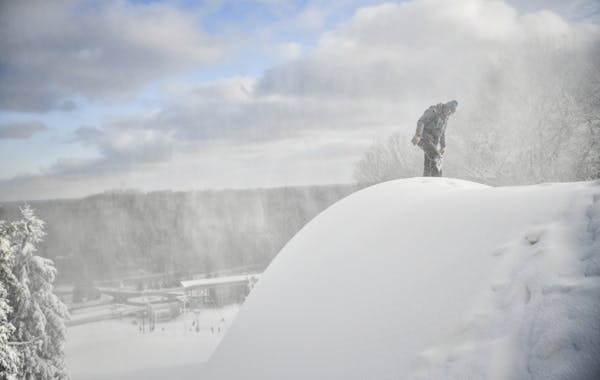 Hyland Hills snowmaker Jack Bees checked the snow at the top of a ski run Friday.