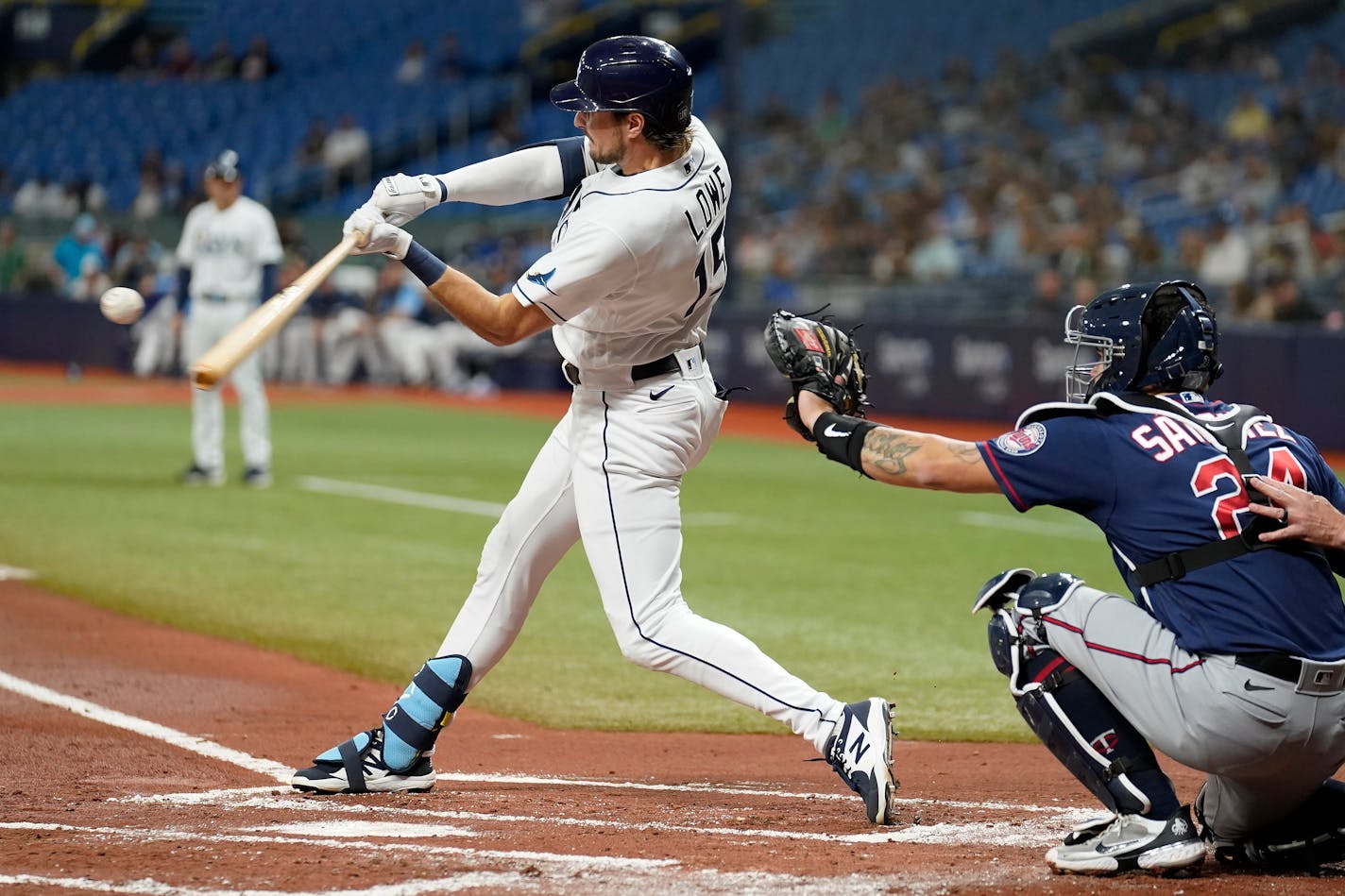 Tampa Bay Rays' Josh Lowe (15) connects for a three-run home run off Minnesota Twins starting pitcher Dylan Bundy during the first inning of a baseball game Friday, April 29, 2022, in St. Petersburg, Fla. Catching for the Twins is Gary Sanchez (24). (AP Photo/Chris O'Meara)