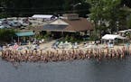 In a July 2009 file image, a gathering at the Solair Recreation League nudist resort in North Woodstock, N.Y., is hardly camera shy. Nakationing -- as