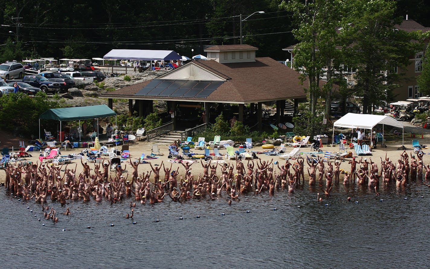 In a July 2009 file image, a gathering at the Solair Recreation League nudist resort in North Woodstock, N.Y., is hardly camera shy. Nakationing -- as in naked vacationing -- is a growing trend that goes well beyond topless beaches.(Bettina Hansen/Hartford Courant/TNS)