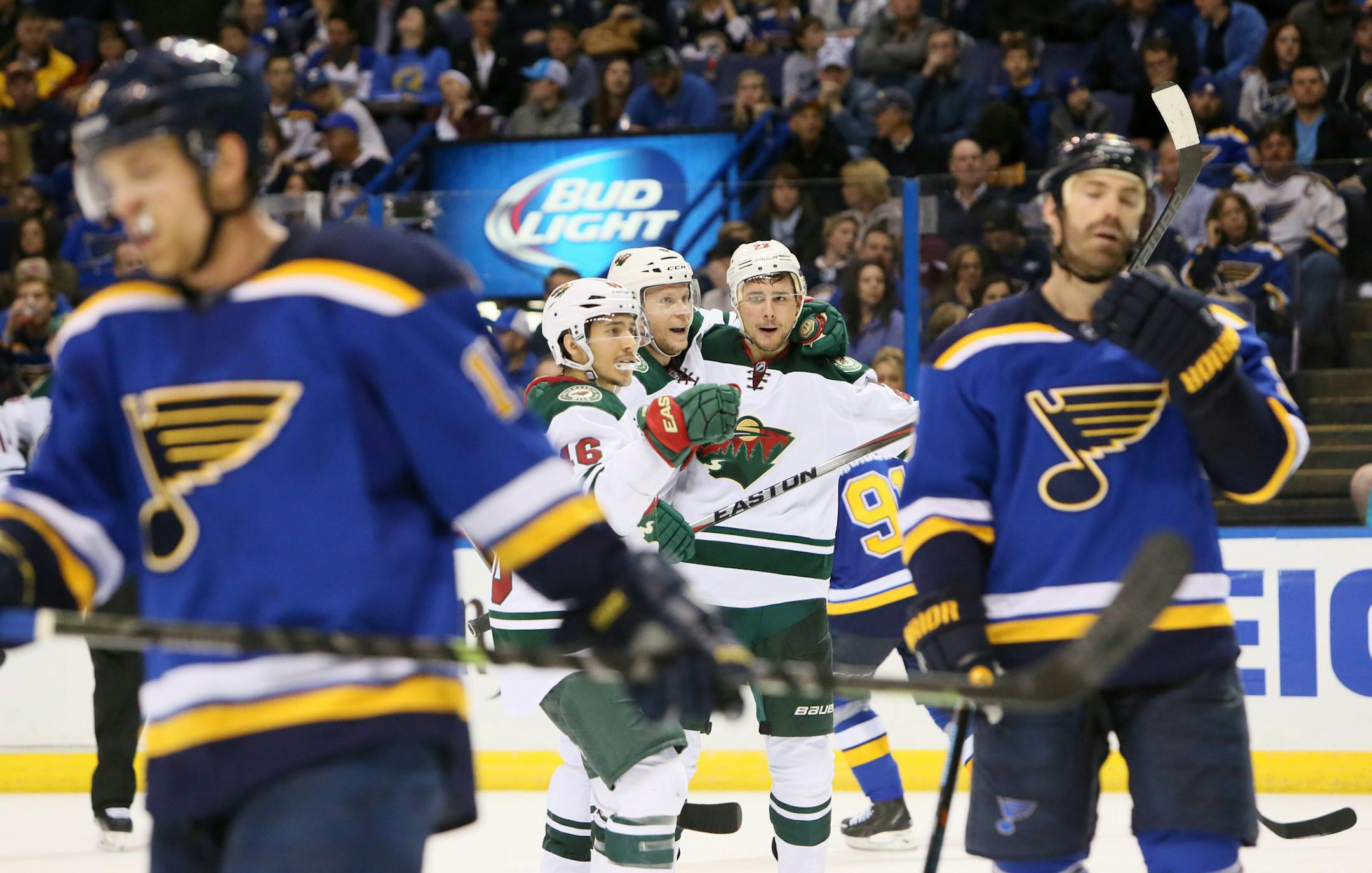 Minnesota Wild's Jared Spurgeon, center left, center Mikko Koivu and Nino Niederreiter, center right, celebrate Niederreiter's second-period goal in Game 5 of an NHL hockey first-round playoff series against the St. Louis Blues on Friday, April 24, 2015, in St. Louis. (Chris Lee/St. Louis Post-Dispatch via AP) EDWARDSVILLE INTELLIGENCER OUT; THE ALTON TELEGRAPH OUT; MANDATORY CREDIT