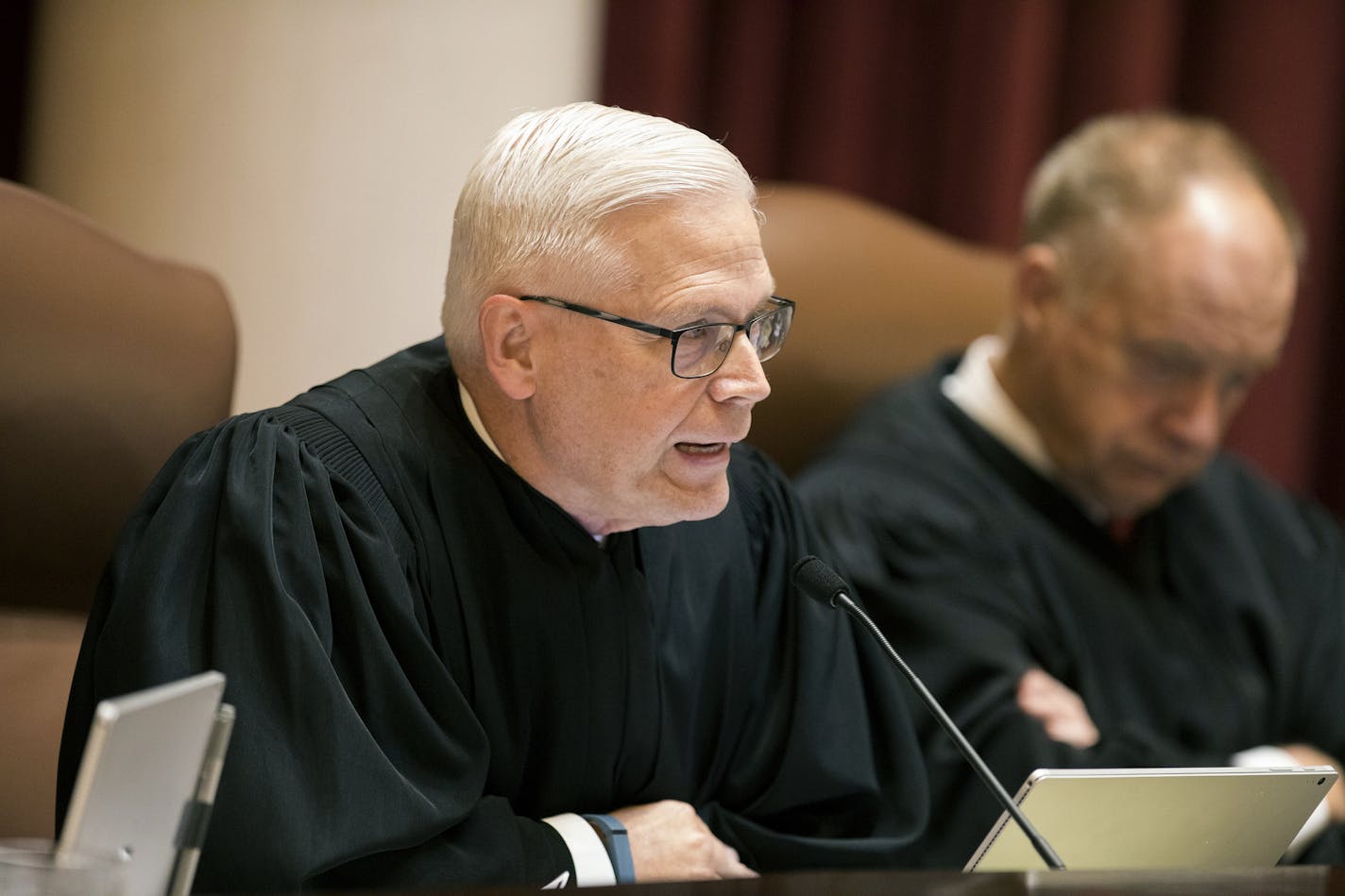 FILE - In this Aug. 28, 2017 file photo, Minnesota Supreme Court Associate Justice David L. Lillehaug asks questions during oral arguments at the Capitol in St. Paul, Minn. Lillehaug says he has Parkinson's disease and won't seek re-election next year. Lillehaug says in a statement via the court that he expects to resign in July 2020. (Leila Navidi/Star Tribune via AP, File)