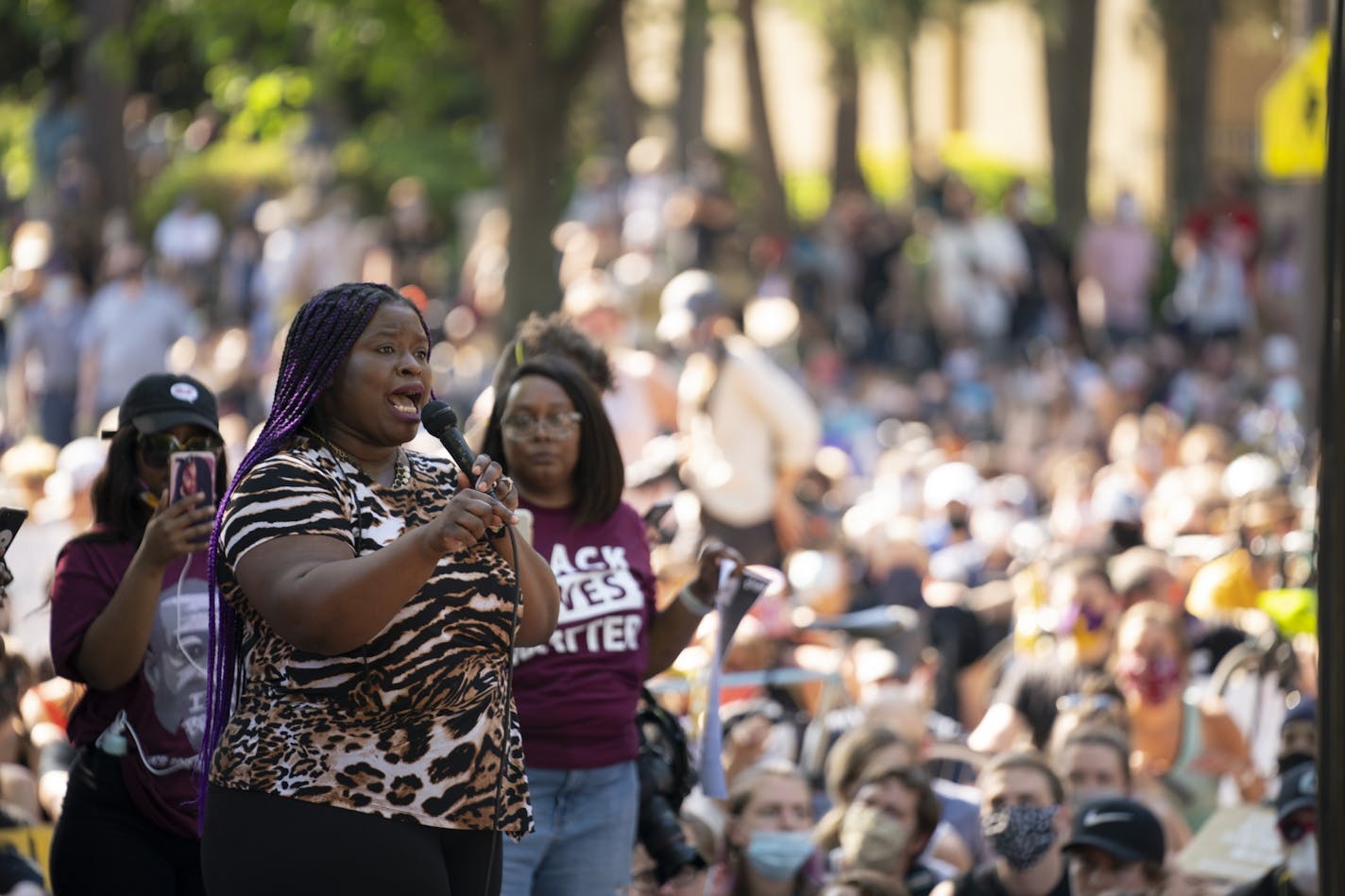 Lawyer and activist Nekima Levy Armstrong spoke to the crowd, seated on Summit Ave. in front of the Governor's residence.