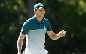Sergio Garcia, of Spain, reacts after saving par on the sixth hole during the final round of the Masters golf tournament, Sunday, April 9, 2017, in Au