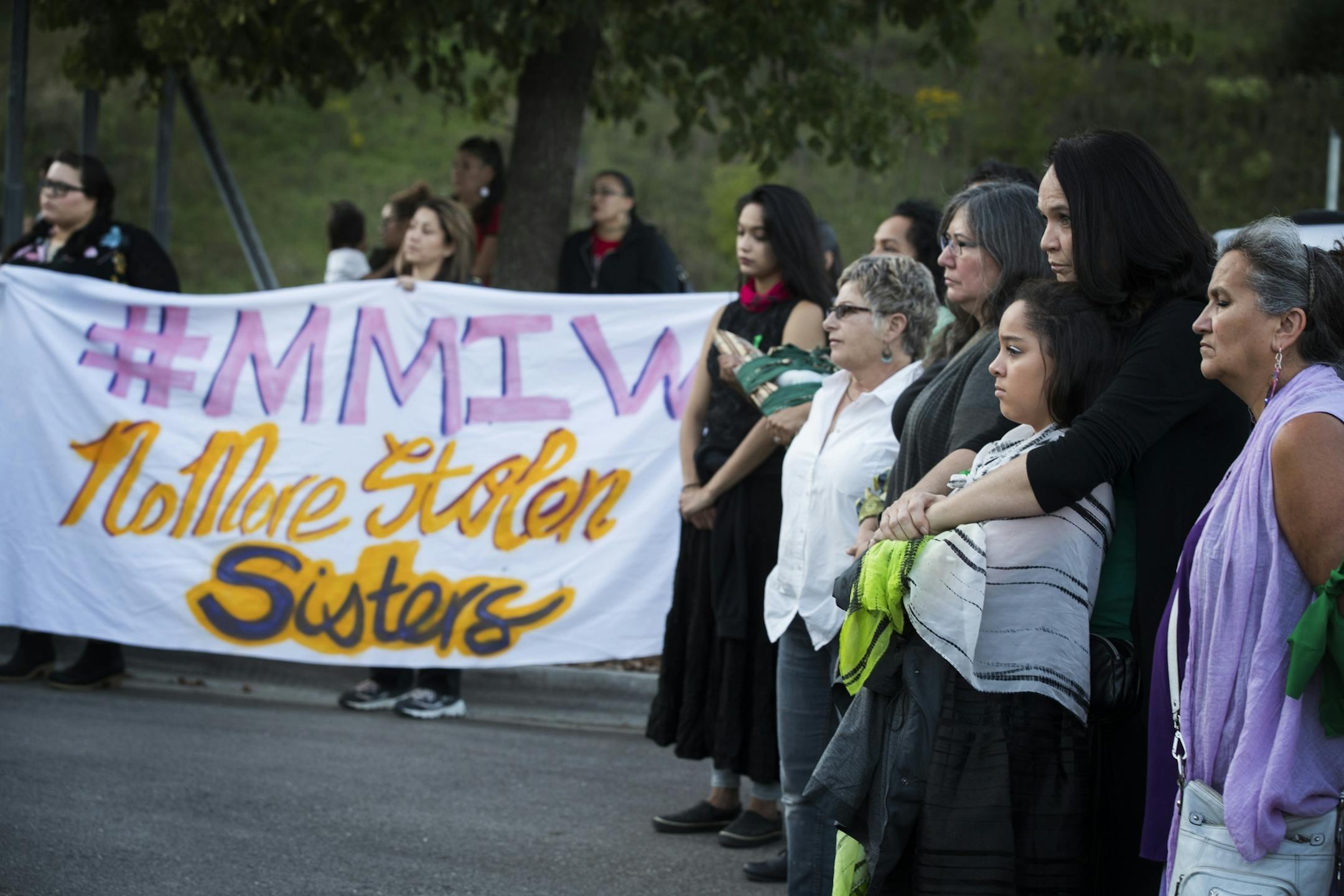 Nicole Matthews, second from right, of Minneapolis and her daughter Kiora Burgess-Matthews, 13, attend a prayer circle for Savanna LaFontaine-Greywind.