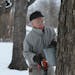 Roger Schmidt, hung a bucket getting ready for this sugaring season. ] Roger Schmidt, 86, taps maple trees behind his home in Plymouth. His family has
