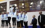 Roseville, shown accepting the first-place trophy at the 2015 girls' gymnastics state meet at the University of Minnesota Sports Pavilion, will miss t