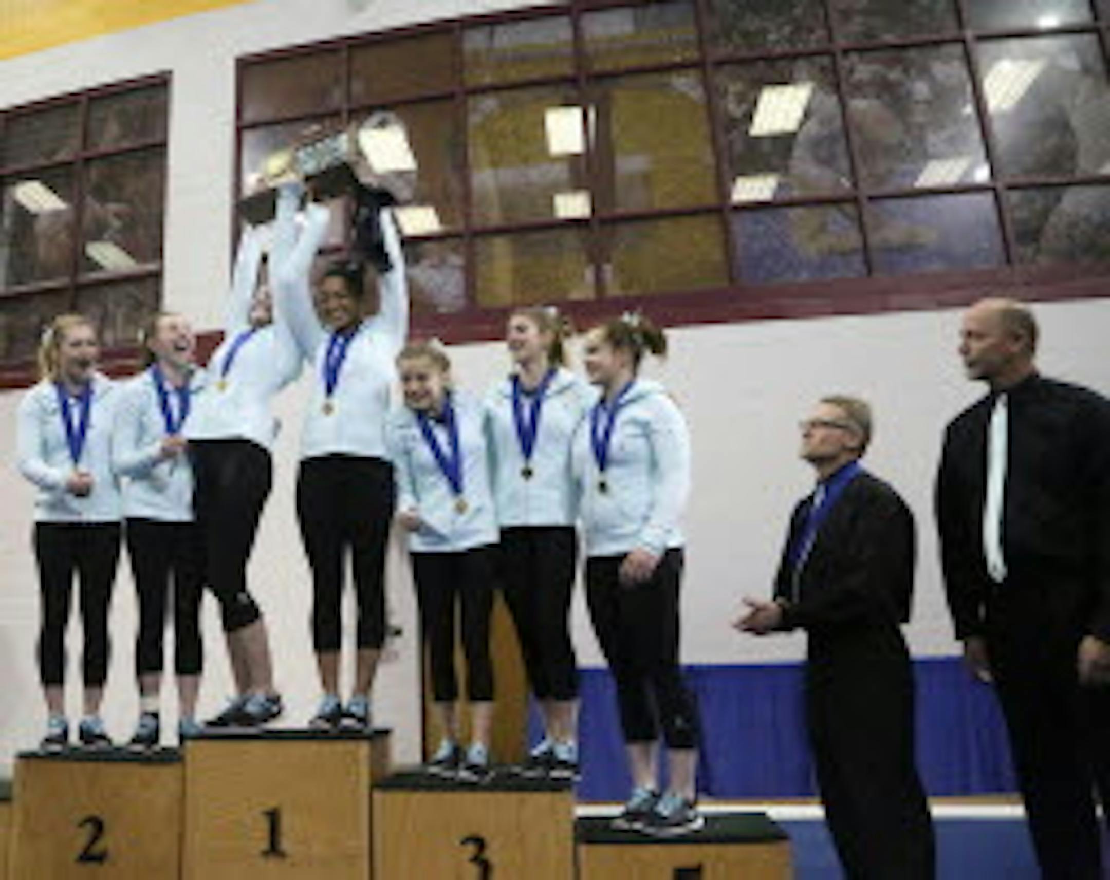 Roseville, shown accepting the first-place trophy at the 2015 girls' gymnastics state meet at the University of Minnesota Sports Pavilion, will miss this year's state meet after 11 consecutive appearances.