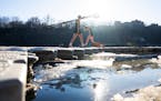 The University of Minnesota women’s rowing team practices in 50-degree temps on the Mississippi River in Minneapolis, Minn., on Wednesday, Jan. 31, 