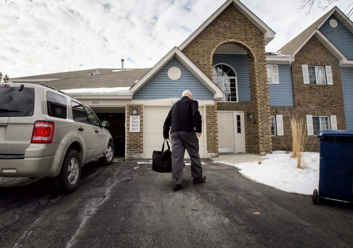 Jack Kennelly carried his gym bag into his Mendota Heights condo after returning from the gym.