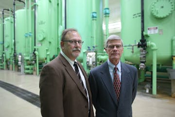 John Drawz, right and Greg Keil in the water treatment plant the cleaned the water of carbon from the old Army artillery factory that contaminated the