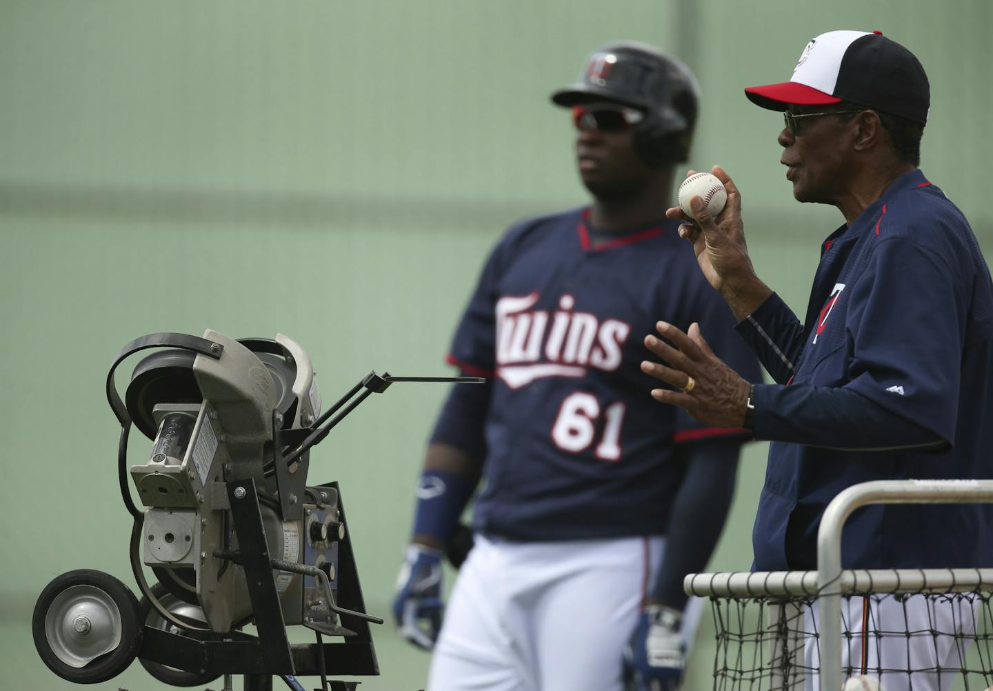 Hall of Famer Rod Carew has been a fixture at Twins spring training, as he was last spring when he fed balls into a pitching machine while offering advice to players such as Miguel Sano (61). After a heart attack and major surgery, he is hoping to return again in 2016.