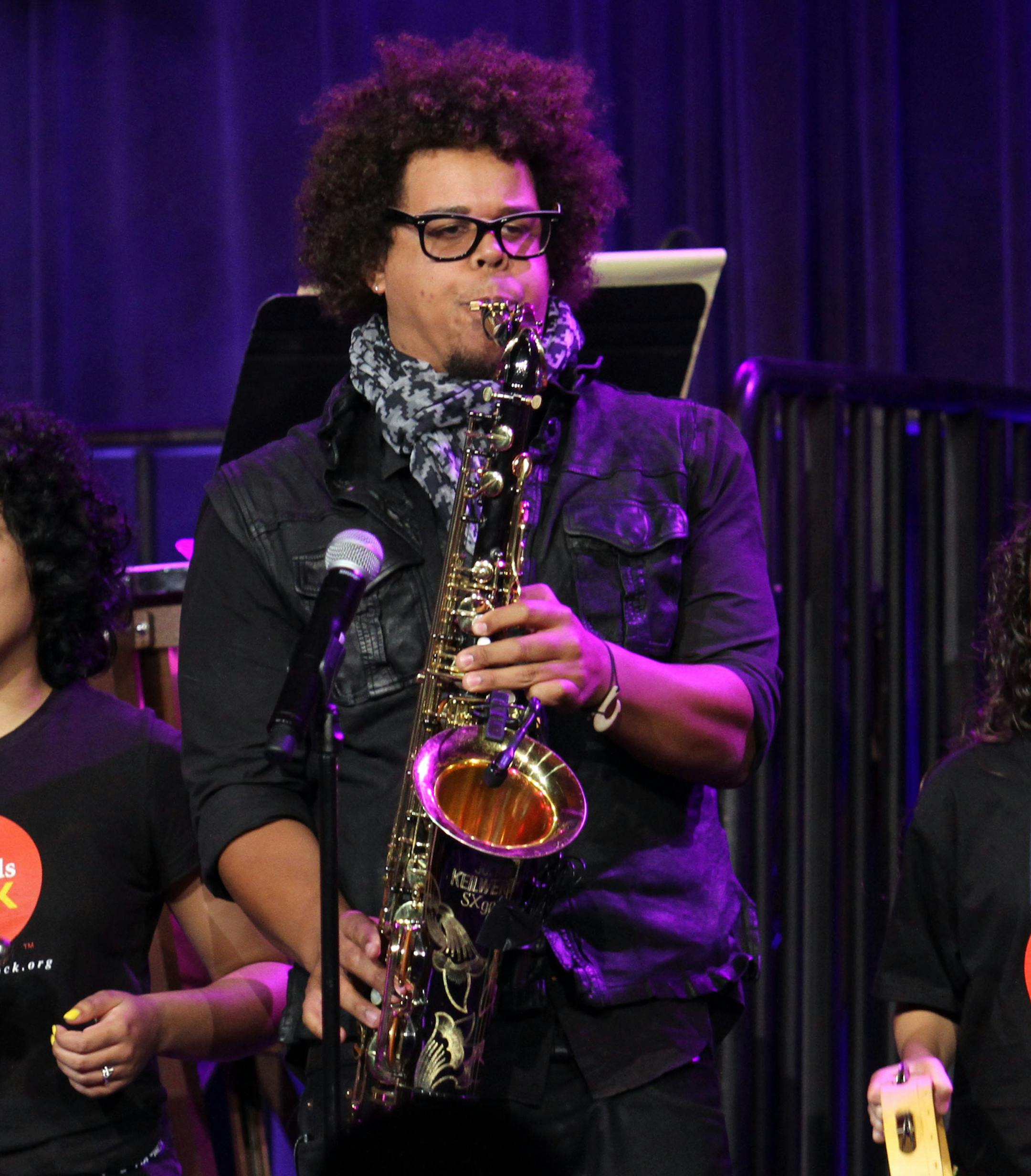 Musician Jake Clemons performs at the "Right To Rock Benefit" at Cipriani Wall Street, on Thursday, Oct. 17, 2013 in New York. (Photo by Greg Allen/Invision/AP) ORG XMIT: MIN2013111111344634