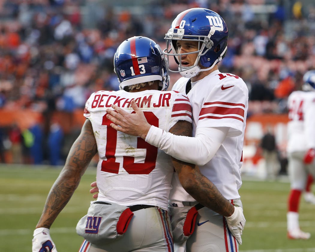 New York Giants wide receiver Odell Beckham (13) celebrates a touchdown catch with quarterback Eli Manning