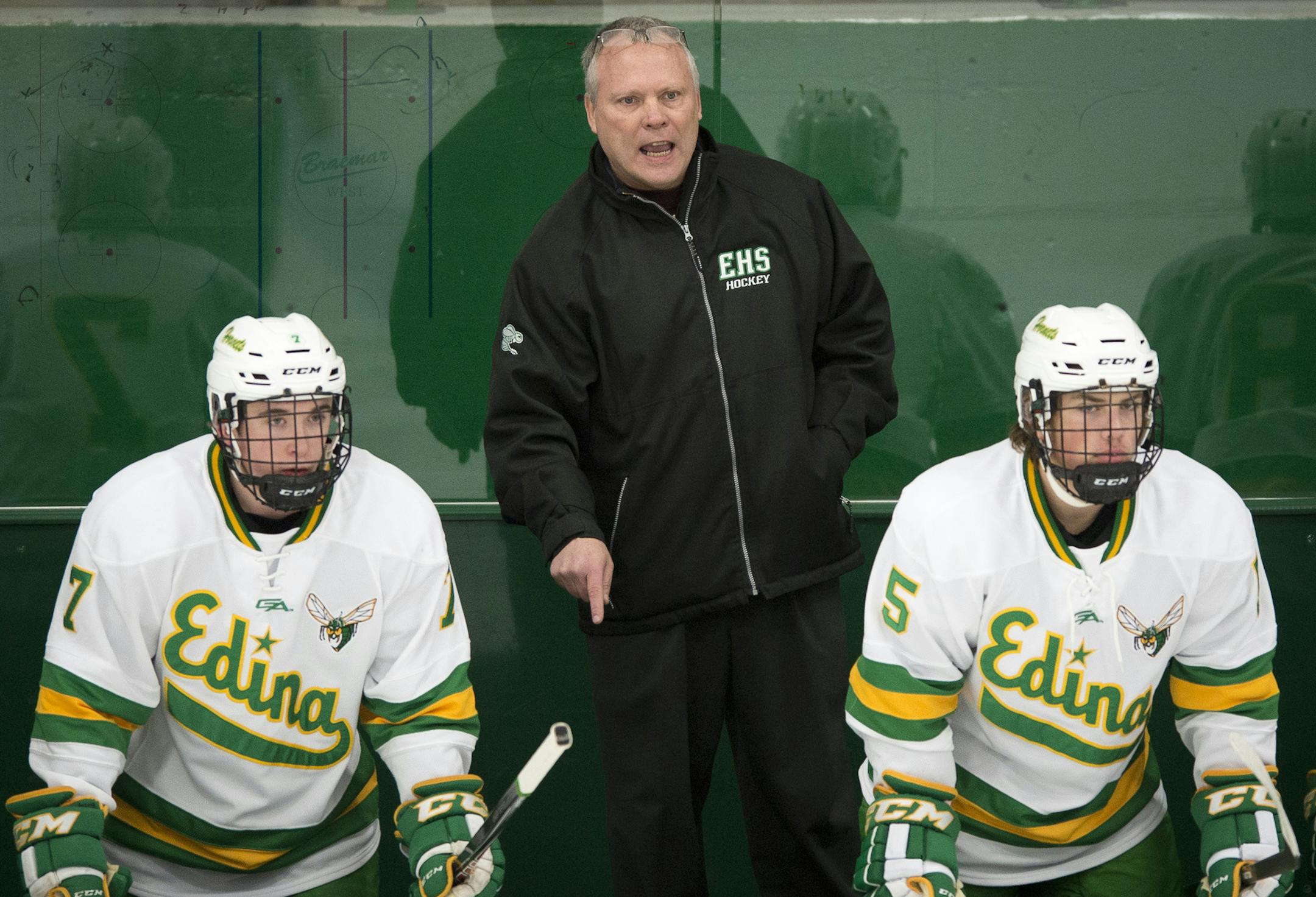 Edina boys' hockey head coach Curt Giles signals to his players after they allowed a goal by Hopkins in the first period. ] (Aaron Lavinsky | StarTribune) The Edina Hornets take on the Hopkins Royals Thursday, Jan. 22, 2015 at Braemar Arena in Edina. The game was photographed for a feature on Edina head coach Curt Giles.
