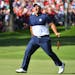 USA's Patrick Reed celebrated after making par to half the first hole Sunday during singles pairings at the Ryder Cup.