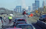 A State Patrol helicopter took off after landing on northbound Interstate 35W to drop off a member of a reconstruction team investigating a fatal acci