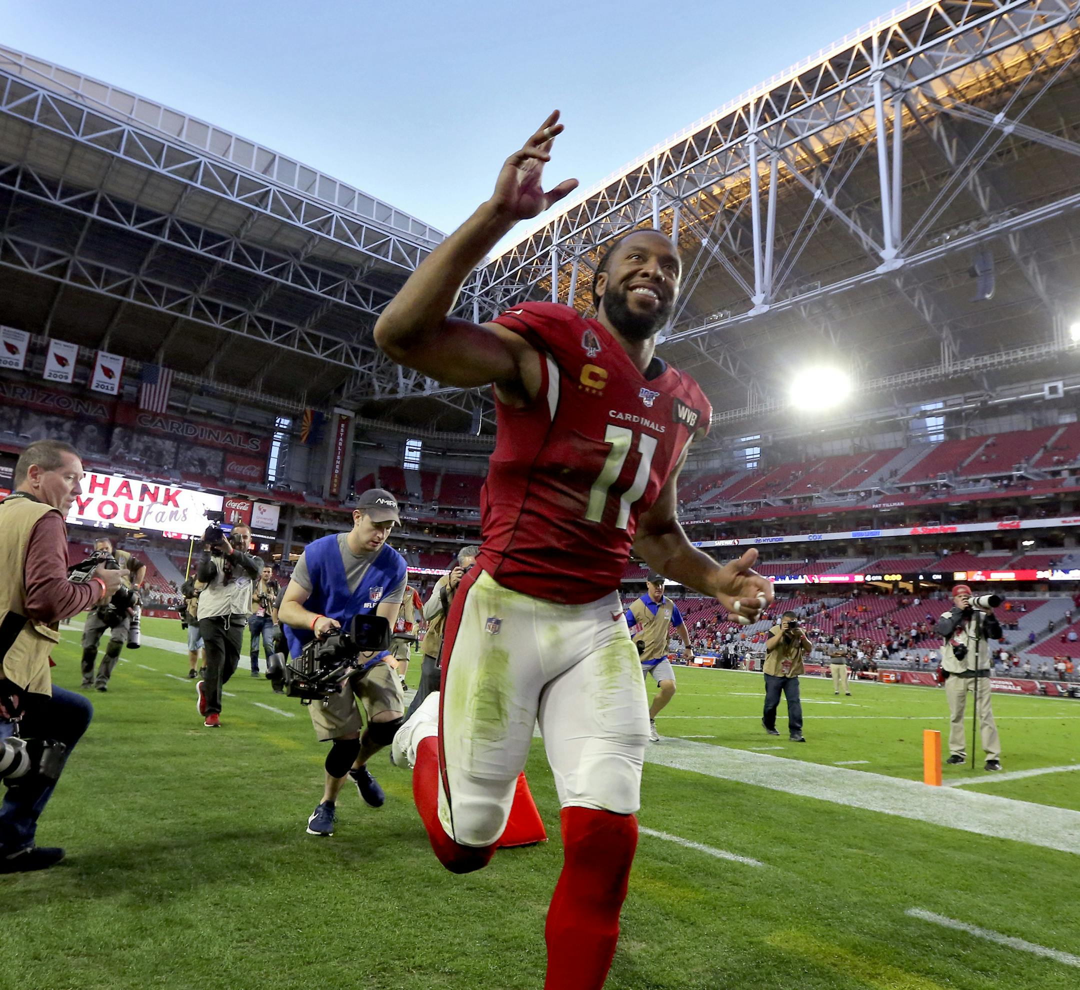 Arizona Cardinals wide receiver Larry Fitzgerald (11) leave the field after f an NFL football game against the Cleveland Browns, Sunday, Dec. 15, 2019, in Glendale, Ariz. The Cardinals won 38-24. (AP Photo/Ross D. Franklin)