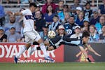 Minnesota United forward Jeong Sang-Bin (11) tumbles after being tripped up by Vancouver defender Mathías Laborda (2) during the first half of the Wh