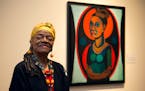 FILE - Artist Faith Ringgold poses for a portrait in front of a painted self-portrait during a press preview of her exhibition, "American People, Blac