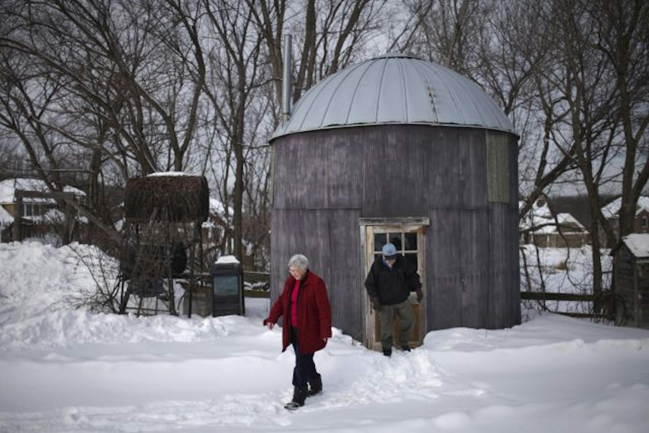 Don and Elaine O'Brien walked this week from the corn crib they use for their maple syrup operation. The O'Briens, who have harvested sap for 30 years, have been told they can't tap trees on land they sold to be part of the Three Rivers Park District.
