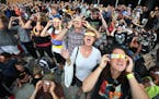 Carolyn Wharton left , John Whaley, Annette Whaley and Lauren Whaley join hundreds of other people to watch a partial eclipse at the Science Museum of