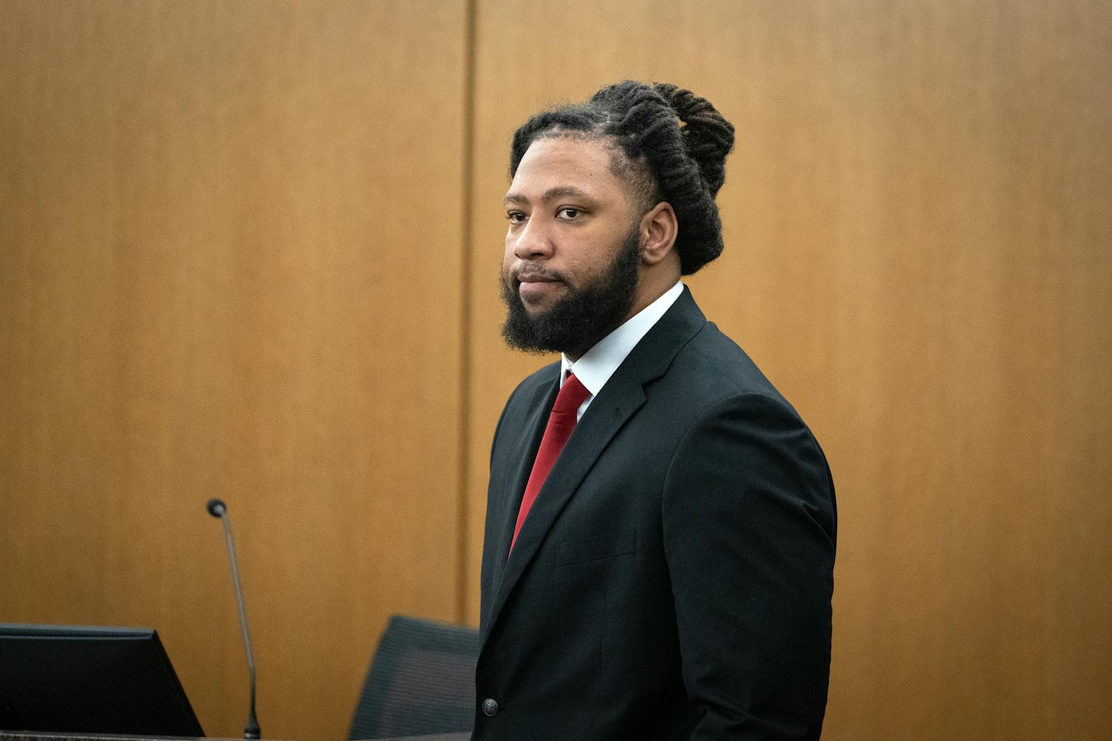 Derrick Thompson stands during his trial at the Hennepin County Government Center in Minneapolis.