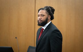 Derrick Thompson stands during his trial at the Hennepin County Government Center in Minneapolis.