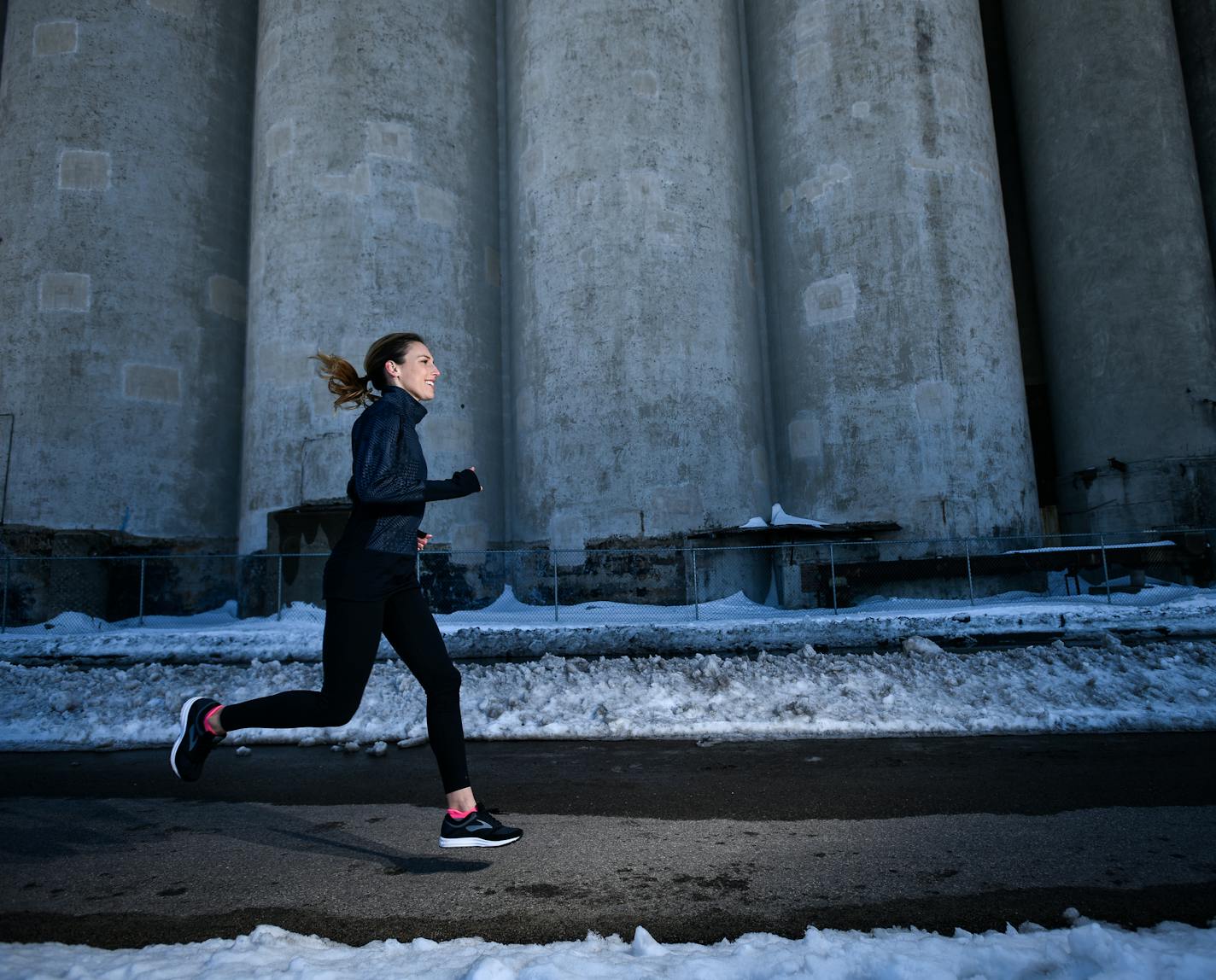 Gabriele Grunewald ran for a portrait Tuesday, April 17, 2018 near Mill Ruins Park in Minneapolis. ] AARON LAVINSKY &#xef; aaron.lavinsky@startribune.com Gabriele Grunewald, an accomplished former Gophers track star and notable for her battle with a rare cancer, offers tips on running in advance of her foundation's 5K race. We photograph Grunewald Tuesday, April 17, 2018 in Minneapolis, Minn.