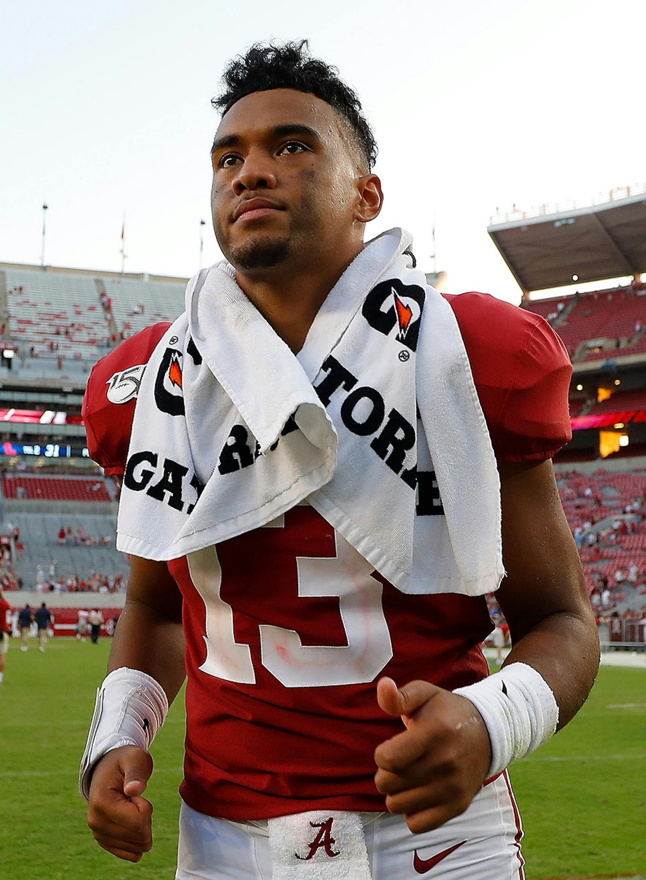 In this file image, Tua Tagovailoa (13) of the Alabama Crimson Tide runs off the field after their 59-31 win over the Mississippi Rebels at Bryant-Denny Stadium on Sept. 28, 2019 in Tuscaloosa, Ala. Tagovailoa declared for the NFL draft. (Kevin C. Cox/Getty Images/TNS) ORG XMIT: 1533624