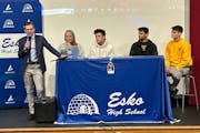 Koi Perich, center, restated Wednesday afternoon at a signing ceremony at Esko High School what he had revealed in the morning: He’ll play for the G
