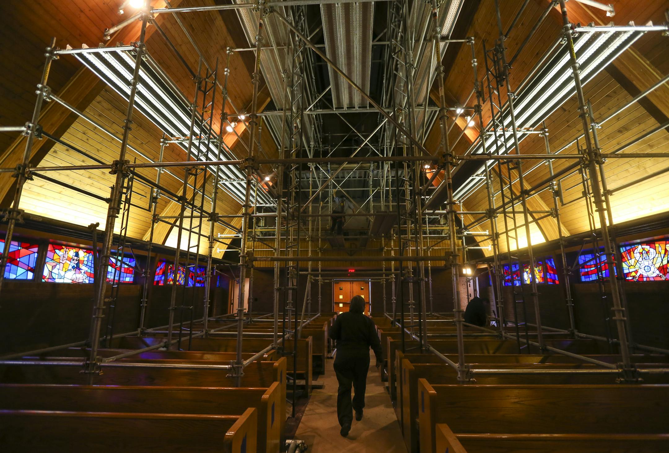 Church president Candy Petersen walked through the sanctuary which is covered in scaffolding to clean the smoke and fire damage. ] RENÉE JONES SCHNEIDER reneejones@startribune.com On Dec. 12, an arson fire at St. Mark's Evangelical Lutheran Church on W. 7th Street in St. Paul, damaged the Sunday school room, completely destroyed the pastors office and left the building dirty with smoke. Photographs taken on Tuesday, December 23, 2014, in St. Paul, Minn.